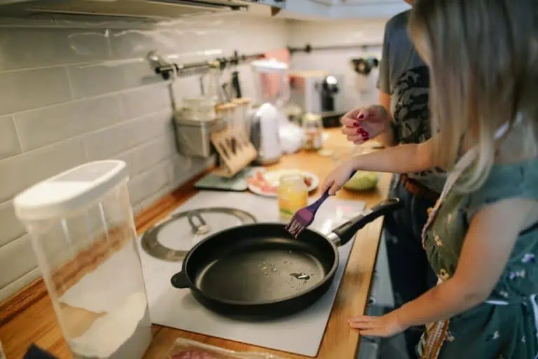 child cooking frying pan