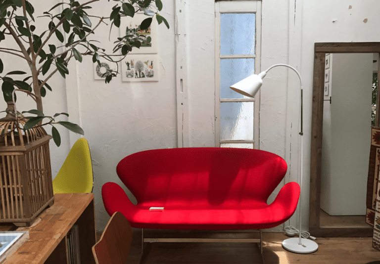 very bright red loveseat