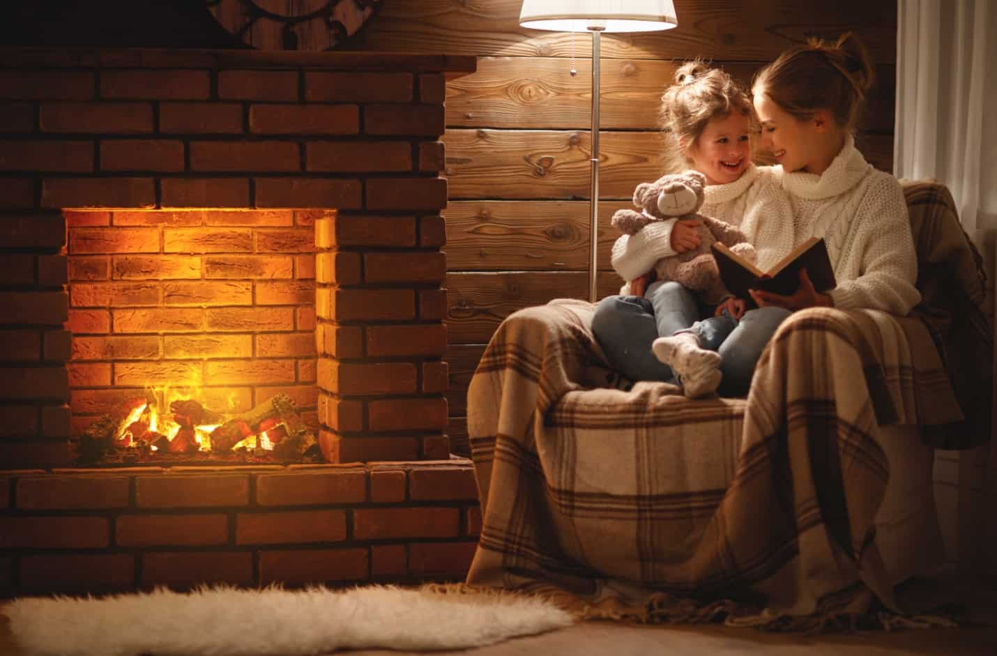 family near fireplace