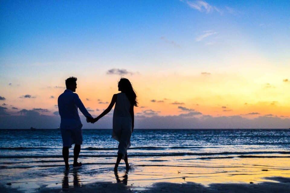 holding hands sunset