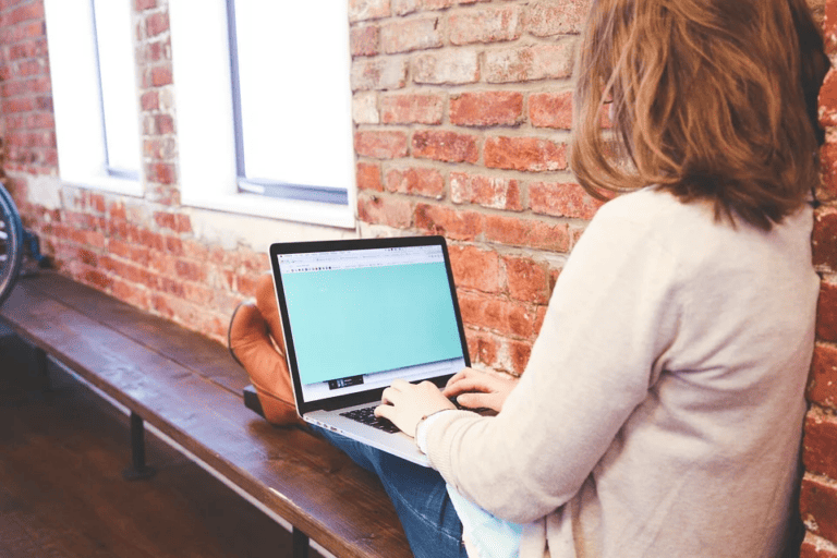 woman typing computer screen