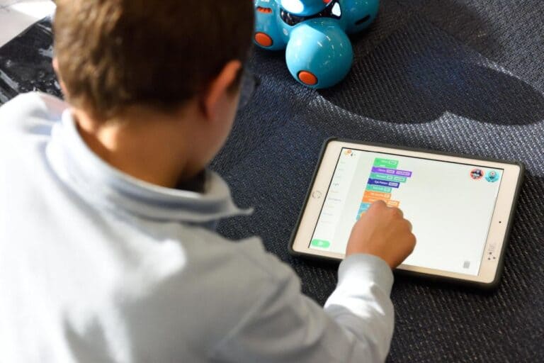 child playing on ipad
