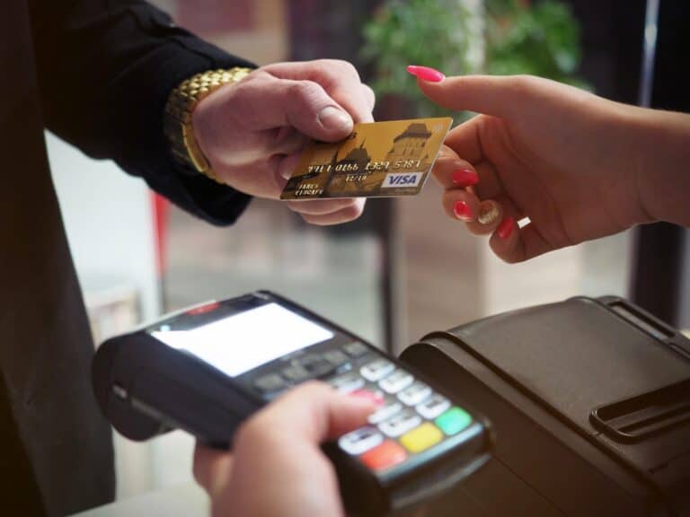 person handing over visa