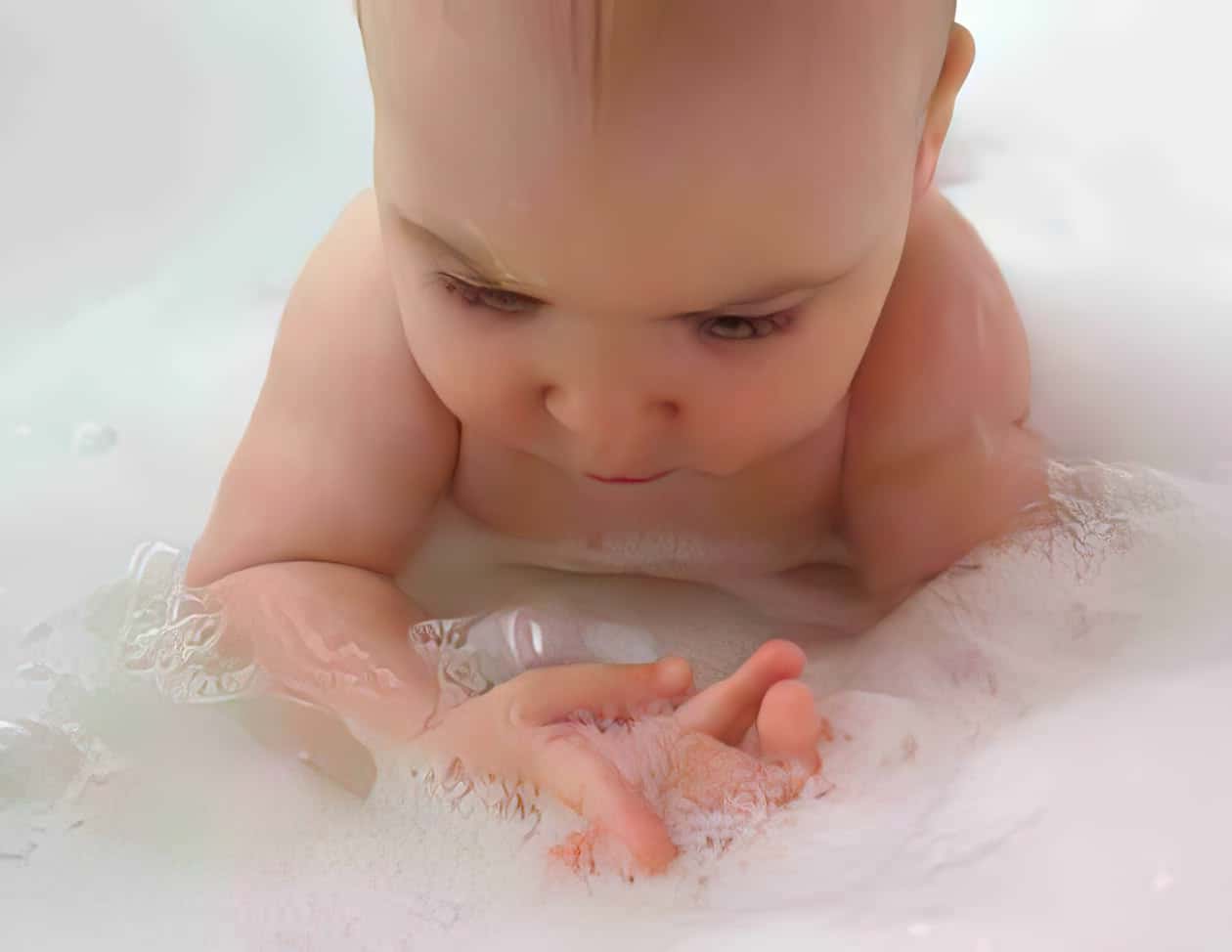 adorable naked child in bathtub