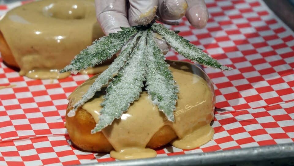 leaf being placed on donut