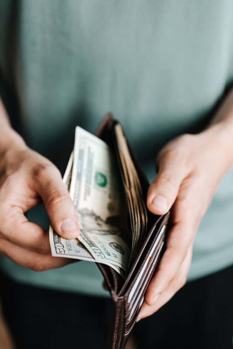 person holding open wallet
