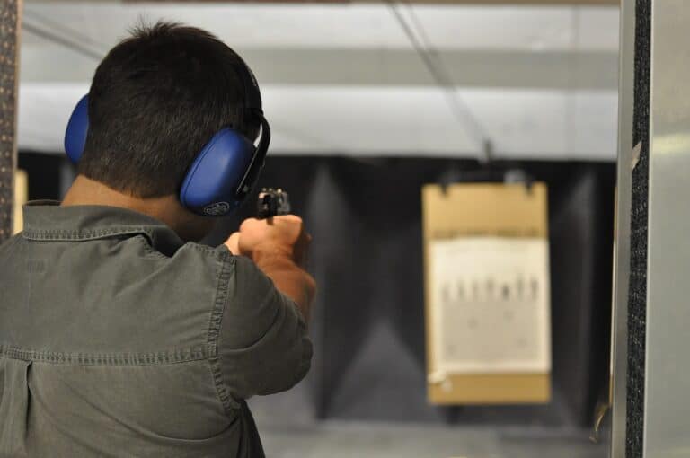 man shooting handgun