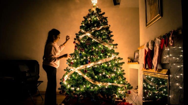 child at christmas tree