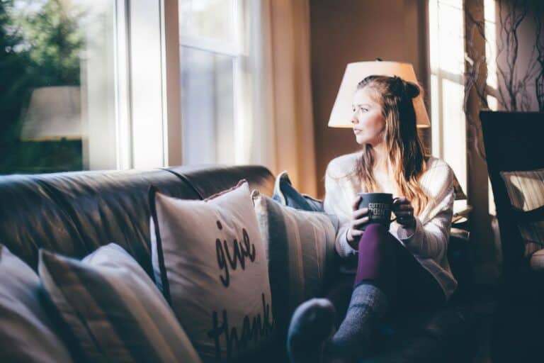 woman sitting on couch