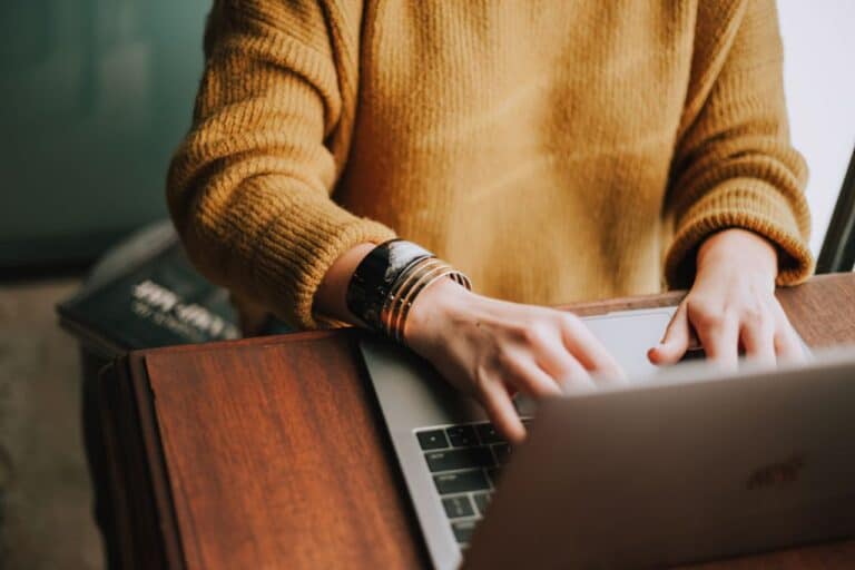 person typing on keyboard