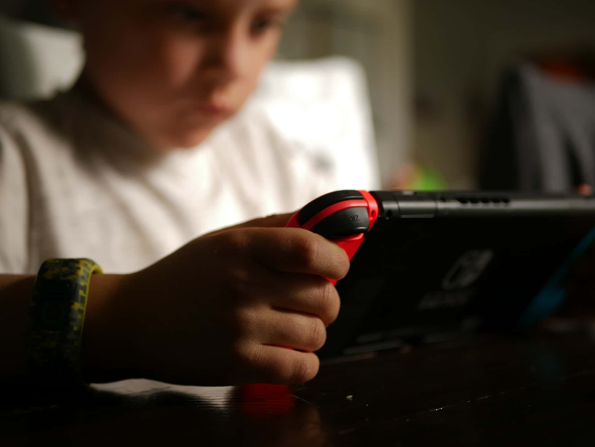 kid playing video game nintento switch