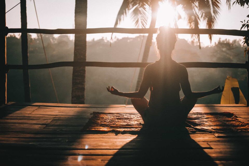9 Activities That Can Help Improve Your Concentration 2 woman yoga at sunset