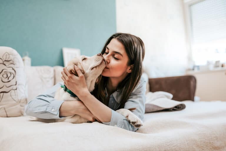 Hot girl kissing dog