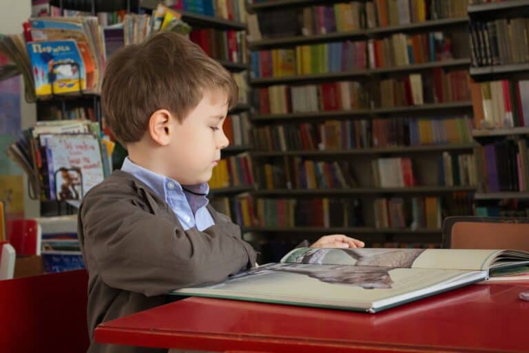 kid studying library
