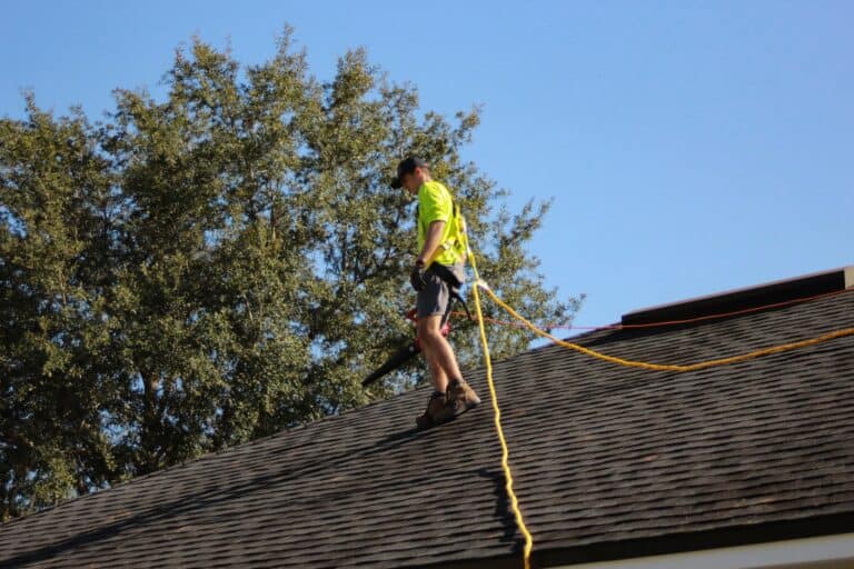man working on roof contractor