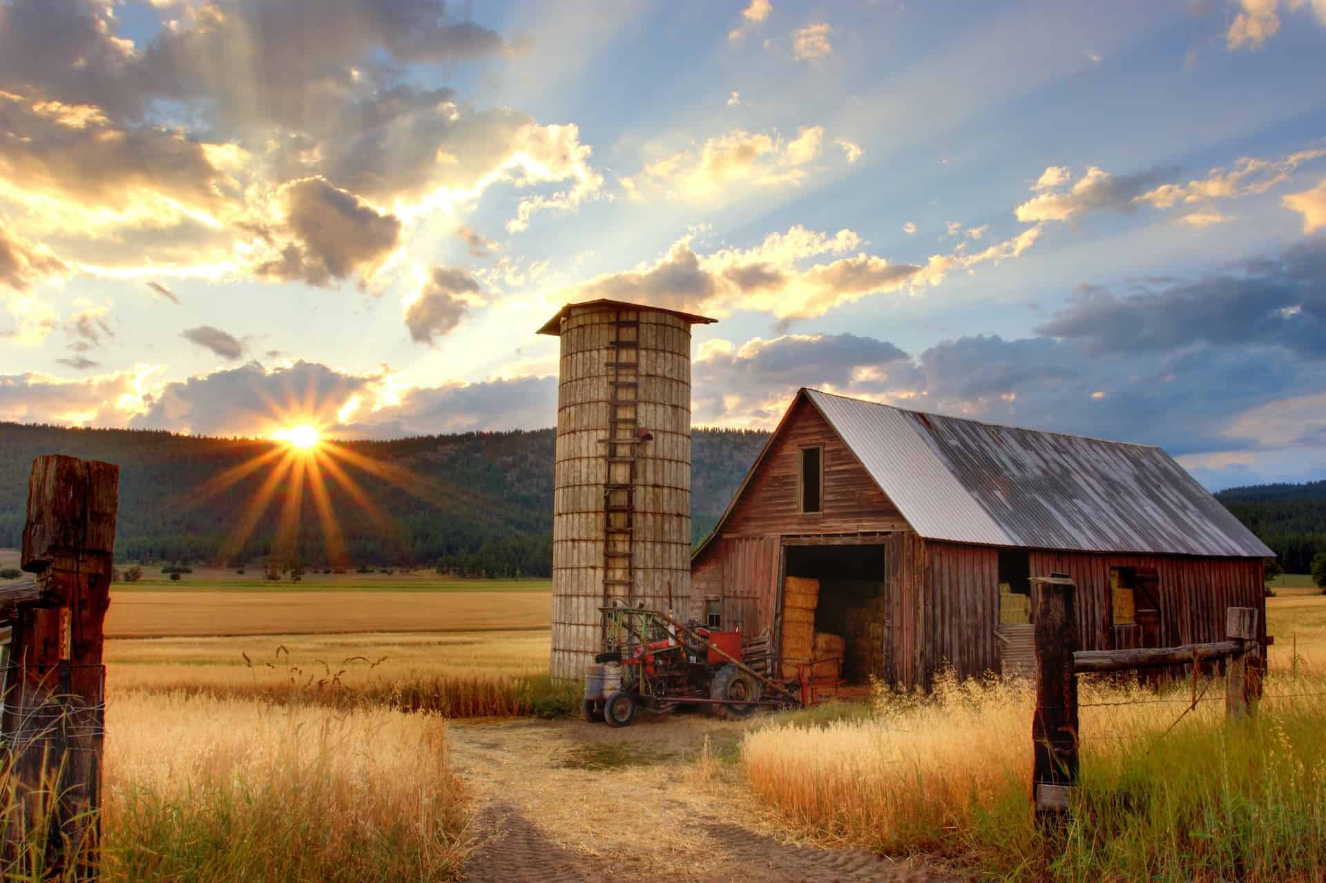 sunset barn with tractor
