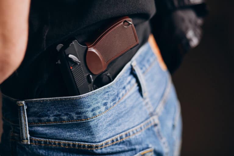 man with gun in back pocket