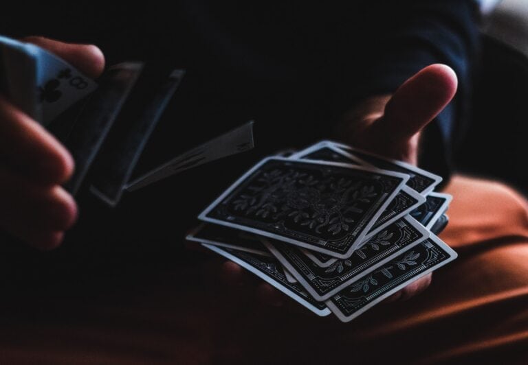 man shuffling cards