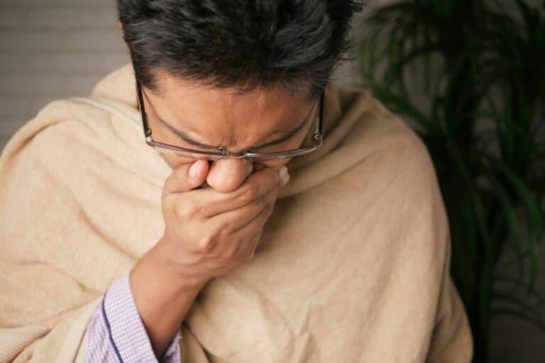 man sneezing