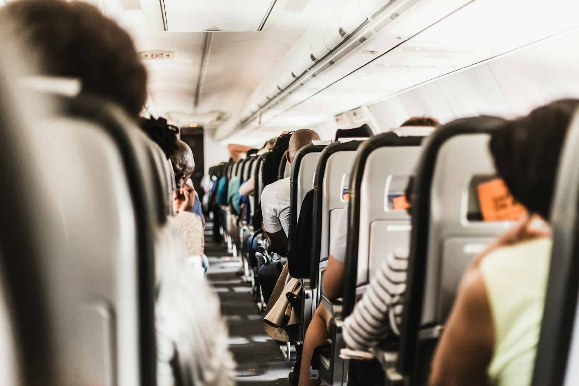 Inside crowded airplane cabin