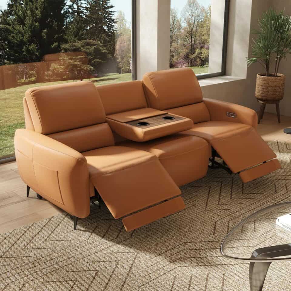 A woman arranges a large woven rug in a stylish, compact living room filled with carefully placed furnishings. Recliner love seat