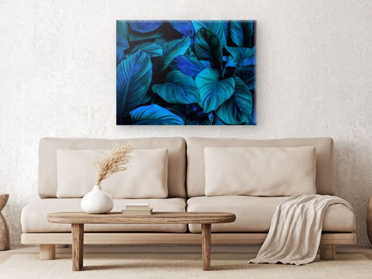 Modern living room couch with blue painting in background