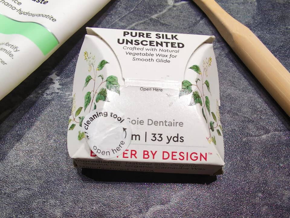 RADIUS Silk Floss Review: 5 Pros, 3 Cons & Eco-Friendly Truth 2 Silk dental floss package with botanical illustration and open label.