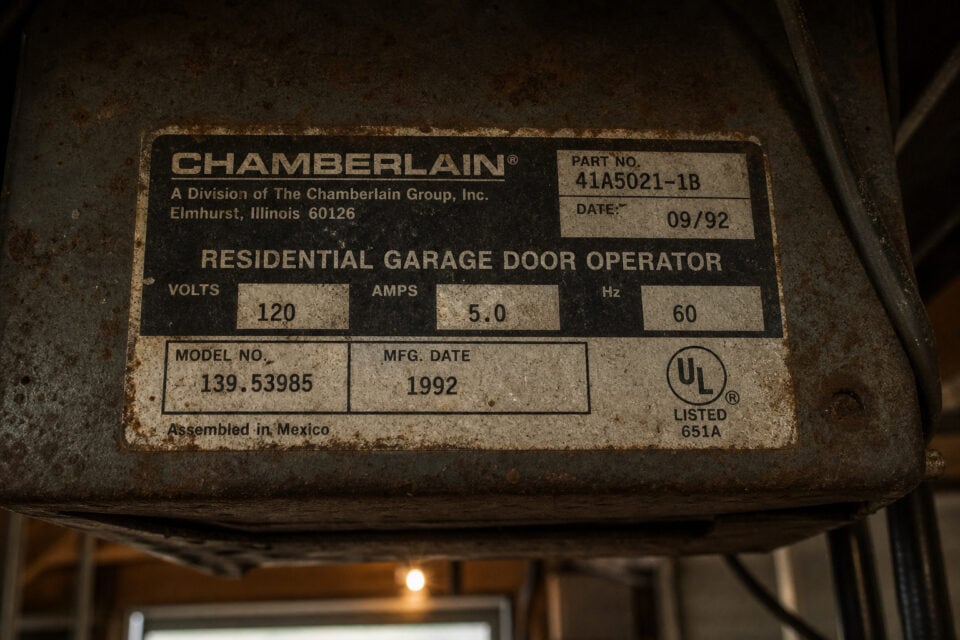 Stop Kids Using the Garage Door: Beyond the 60-Inch Rule 8 Close-up of Chamberlain residential garage door opener label showing model number, manufacturing date, and electrical specifications.