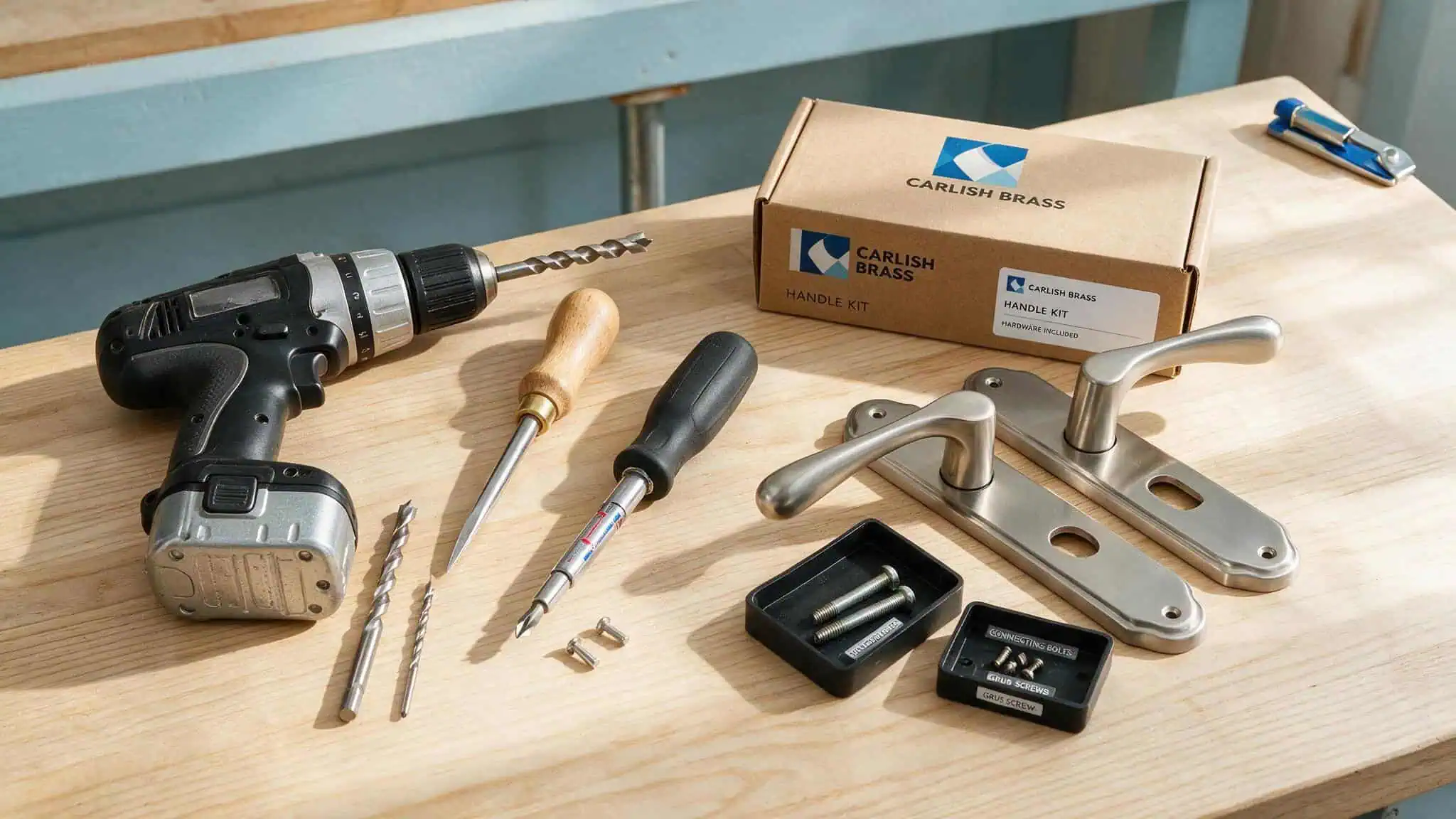 Tools and materials for installing a door knob with plate including drill bits and handle kit.