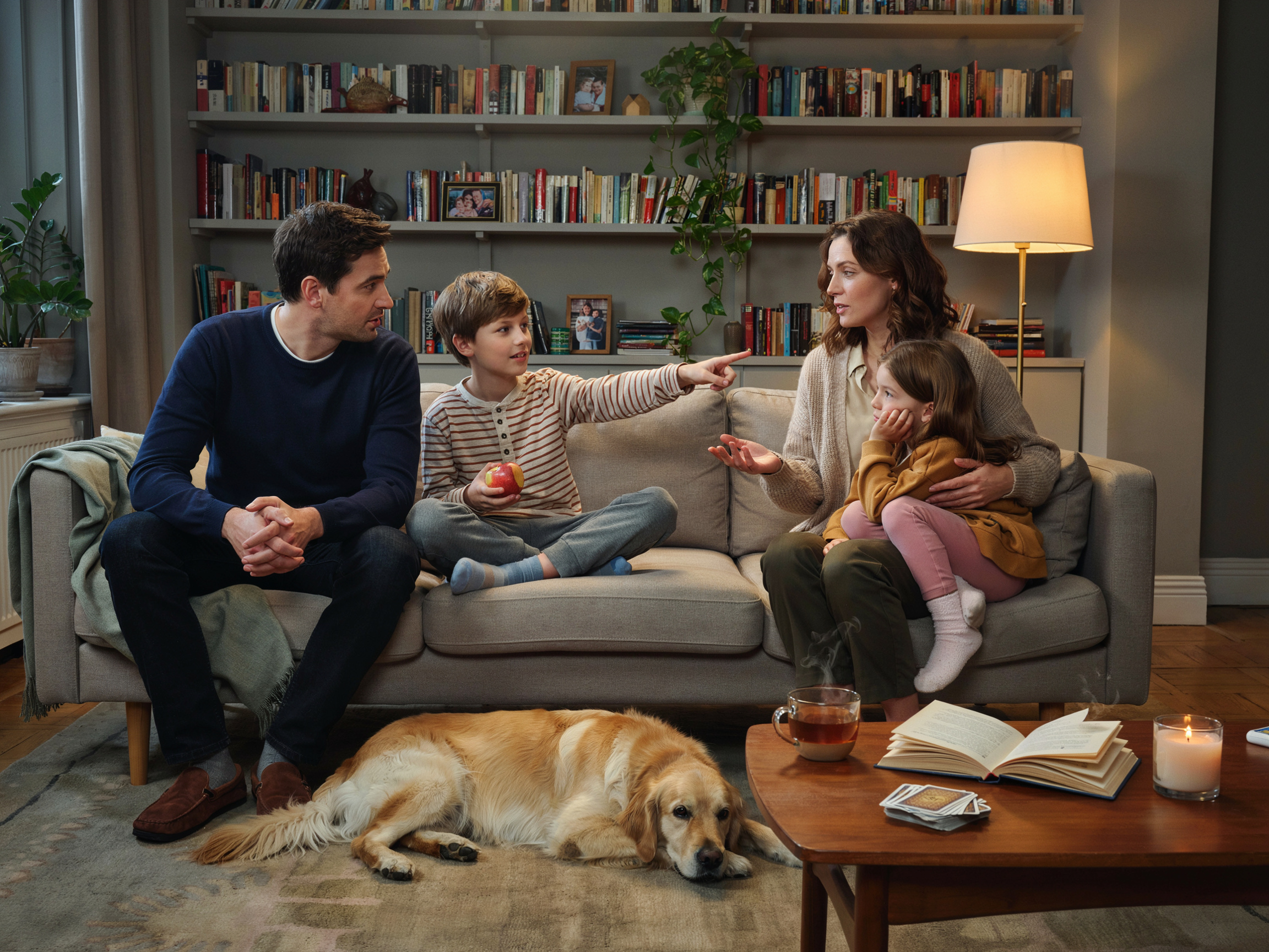 What Is the Value of Family? A Practical Guide to Defining What Matters Most 4 Family gathered in a living room discussing their shared values and what matters to them.