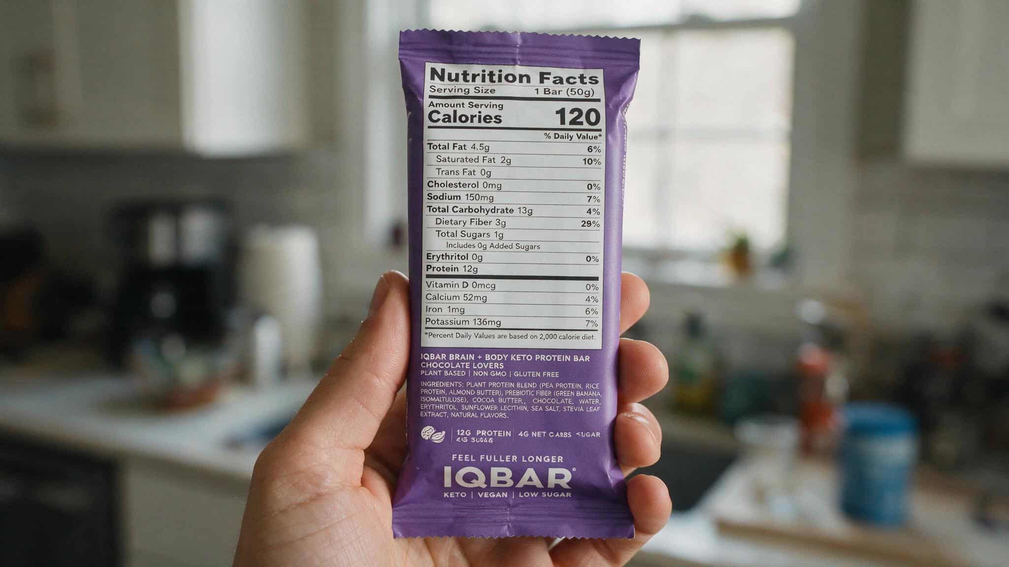 IQBAR nutrition facts label showing 12g protein, 8g fiber, and 1g sugar per serving.