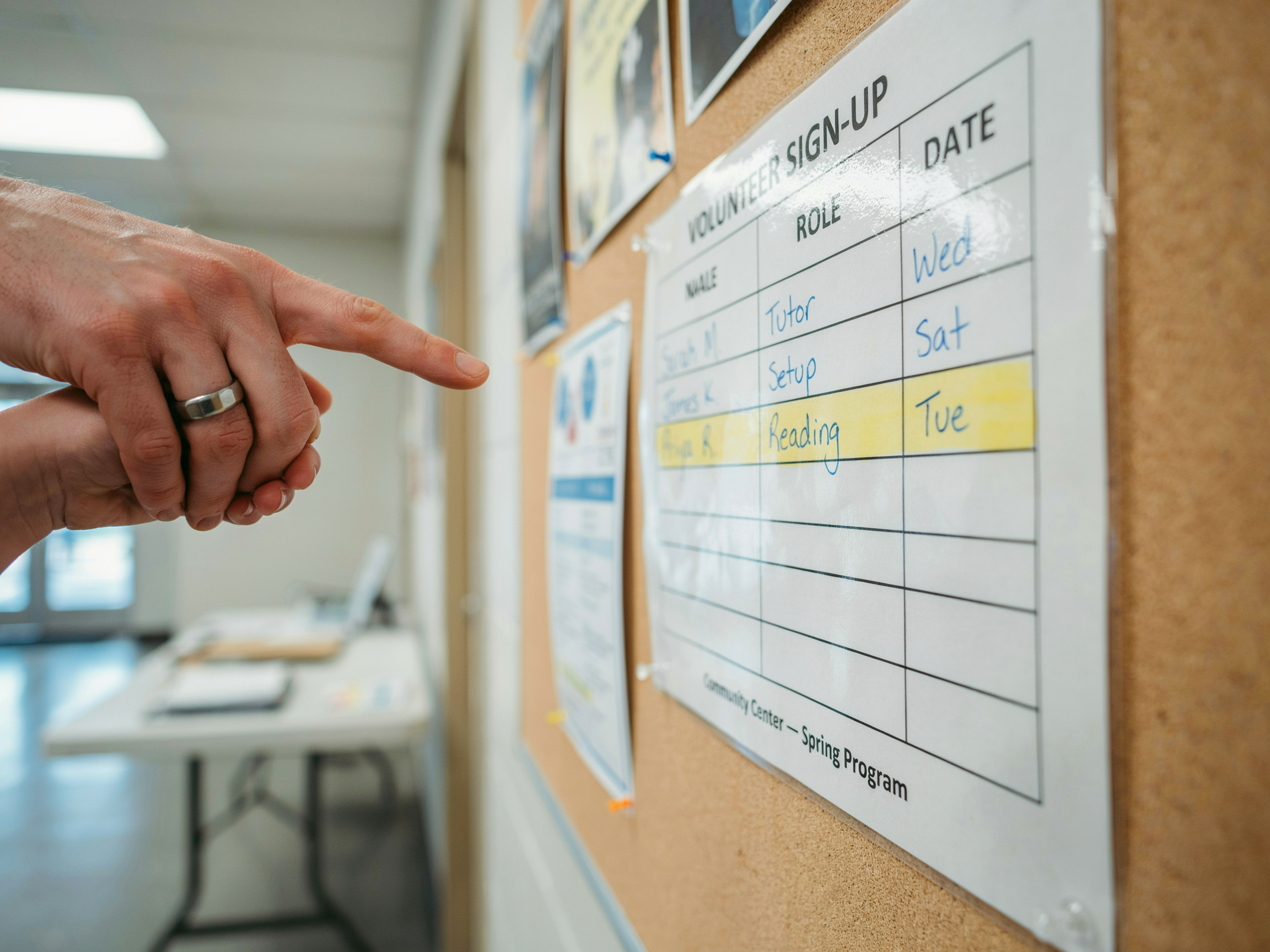 What Is the Value of Family in Sociology? A Data-Driven Look at How Families Transmit Values 4 Parent guiding child to sign up for volunteer work, showing explicit parental guidance in action.