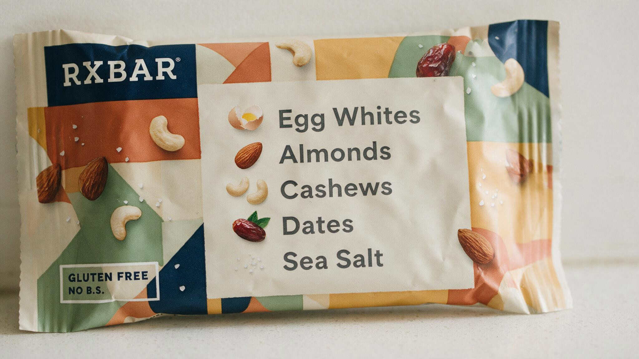 IQ Bar vs RX Bar: Ingredients, Taste, and Nutrition Compared 2 Close-up of RXBar wrapper showing its five-ingredient list: egg whites, almonds, cashews, dates, sea salt.