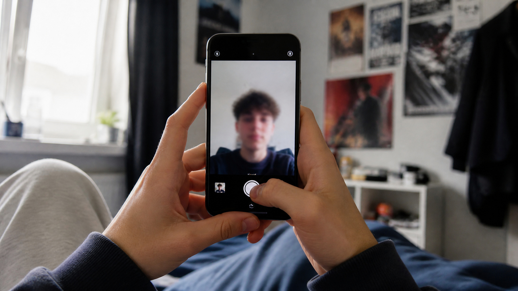 Teenager holding smartphone with front camera, reflecting on selfie culture and youth appearance pressure